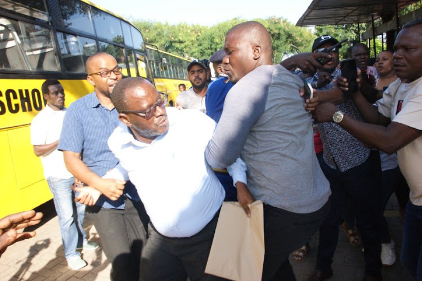 FIST FIGHT BREAKS OUT AS PARENTS FORCEFULLY THROW OUT SCHOOL`S BOARD CHAIR